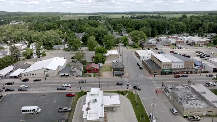 Lake City, Michigan downtown with drone video moving sideways.