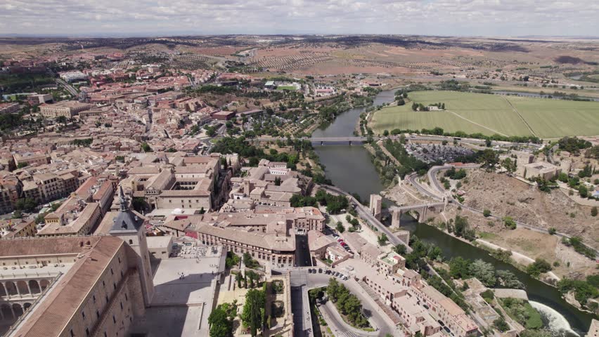 Aerial flyover of Alcazar de Toledo, overlooking river tagus. Spain