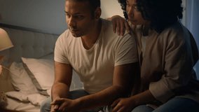 African American woman wife girlfriend calming comforting support sad upset offended man apologizing ask forgiveness after family couple quarrel conflict in bed at night erectile dysfunction problem - Powered by Shutterstock - Get 15% off with code: PIKWIZARD15