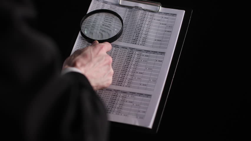 Businessman looking through a magnifying glass to contract Royalty-Free Stock Footage #1108256283