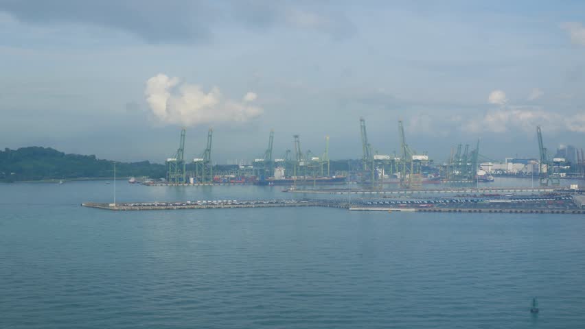 view landscape of a day cityscape container at pier port of singapore. Aerial view to port of singapore with many cranes in early morning. Commercial port of Singapore Royalty-Free Stock Footage #1108258279