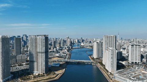 Modern urban waterfront city aerial view. Drone point of view.の動画素材