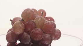 Video of a bunch of grapes on a round turntable
