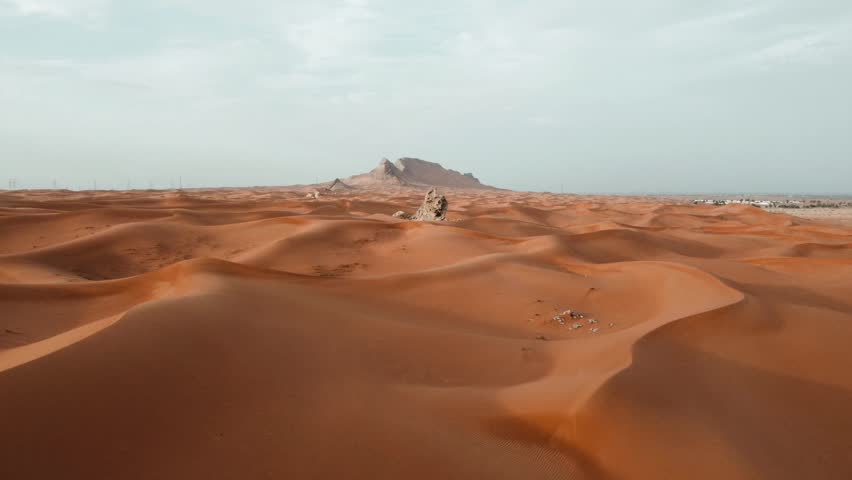 Aerial Footage drone Sharjah Dubai desert in United Arab Emirates during sunset