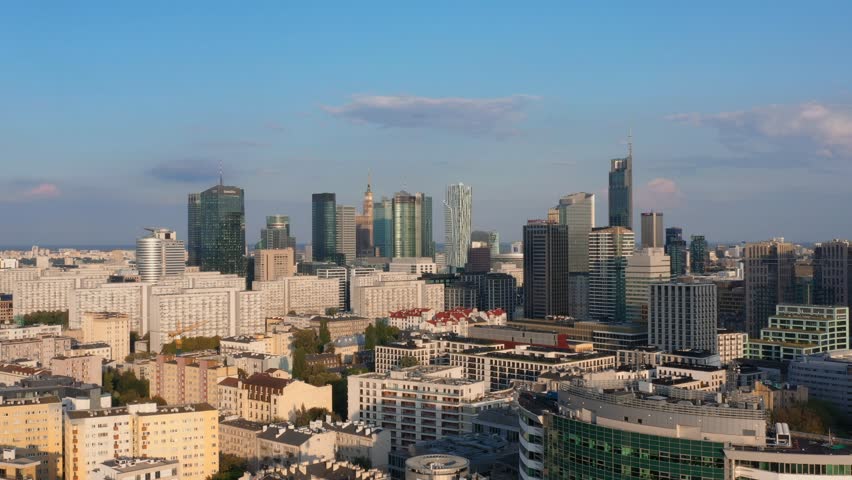 Warsaw skyline cityline downtown aerial view cinematic view. Skyscrapers city at sunset. Top view of the metropolis during sunset. Top view of the metropolis during sunset. Many office glass buildings
