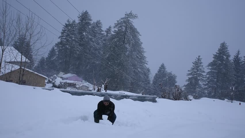 Men throwing snow in the air in winter holidays, Auli, Uttarakhand, india. Royalty-Free Stock Footage #1108268895