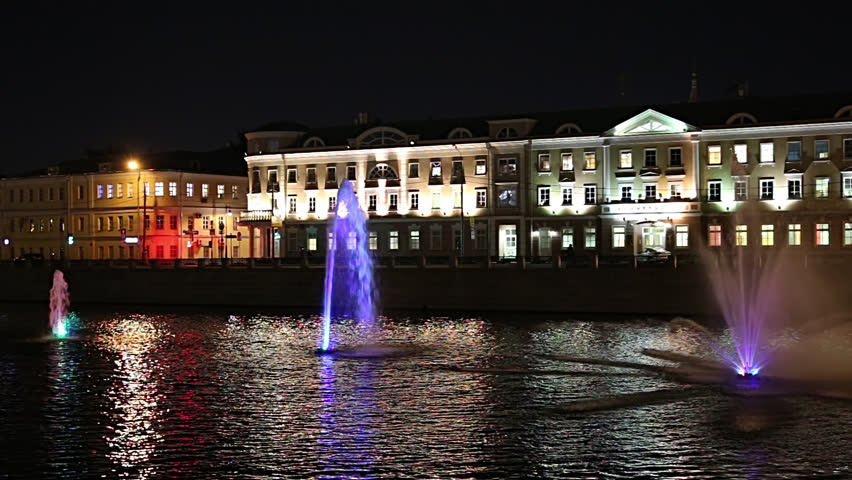 Fountains on the Drainage channel. Bolotnaya Embankment and Kadashevskaya Naberezhnaya (Embankment). Luzhkov (Tretyakov) bridge (at night), Moscow city historic center, popular landmark. Russia  