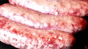 Sizzling Sensation: 4K Close-Up of Italian Sausage Cooking in the Oven