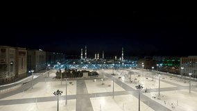 Timelapse of a sunrise over the Prophet's Mosque in Medina, Saudi Arabia. This video captures the tranquil majesty of this spiritual landmark, a place of worship in the heart of the Middle East.