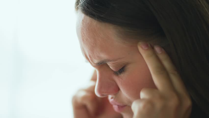 Female migraine.girl rubs her head with her hands.Sick head fatigue illness at home at work.Migraine afternoon sickness treatment. sick girl's head holds her head with her hands.Women's health concept | Shutterstock HD Video #1108280607