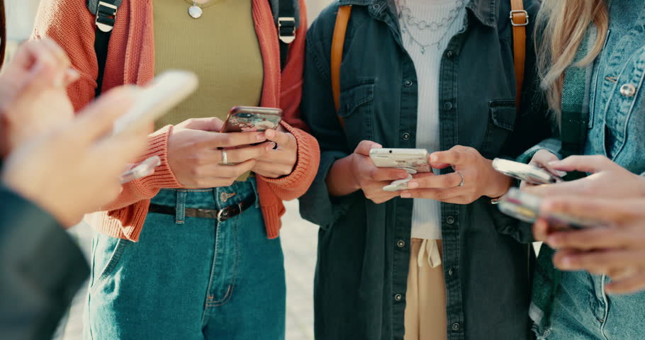 Hands, phone and circle with friends, campus and mobile connection with scroll, typing and click in summer. Girl students, smartphone and huddle for social network app at high school in Los Angeles Royalty-Free Stock Footage #1108281713