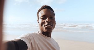 Fitness, beach and black man, video call and arm flex at the ocean for selfie, recording or training. Exercise, portrait and African male social media workout influencer live streaming at the sea