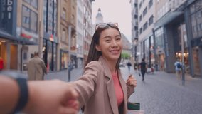 Asian young man and woman shopping goods outdoors in department store. Attractive couple hold shopping bags then walking together with happiness, enjoy purchasing in shopping mall marketplace center. - Powered by Shutterstock - Get 15% off with code: PIKWIZARD15