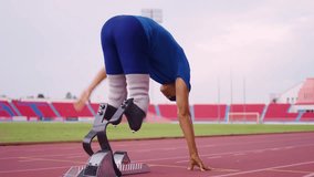 Asian para-athletes disabled with prosthetic blades running at stadium. Attractive amputee male runner exercise and practicing workout for Paralympics competition regardless of physical limitations. - Powered by Shutterstock - Get 15% off with code: PIKWIZARD15