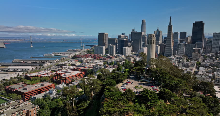 San Francisco California Aerial v111 low flyover telegraph hill neighborhood with coit tower on hilltop overlooking at bay bridge, chinatown and downtown cityscape - Shot with Mavic 3 Cine - May 2022 Royalty-Free Stock Footage #1108293701