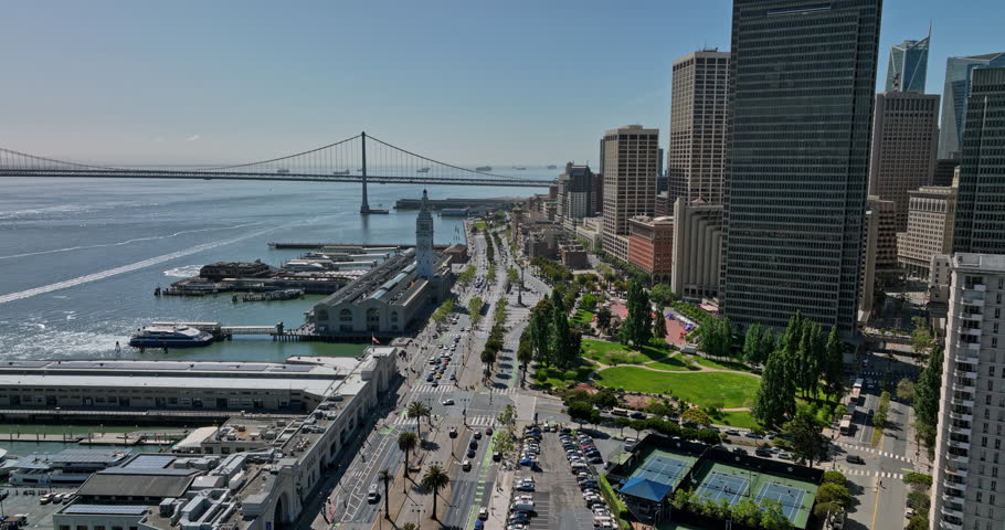 San Francisco California Aerial v147 drone fly along embarcadero from northern waterfront towards financial district capturing bayside downtown cityscape and bridge - Shot with Mavic 3 Cine - May 2022