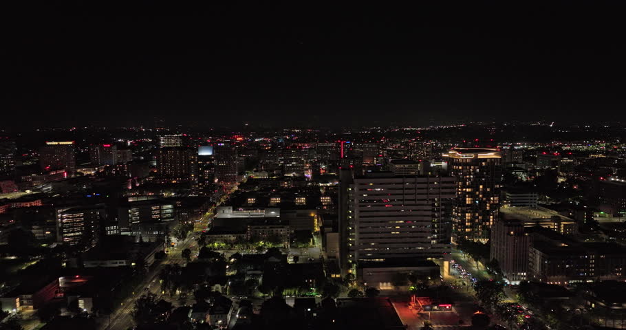 San Jose California Aerial v3 cinematic drone flyover and around downtown capturing illuminated cityscape, state university campus area and city hall at night - Shot with Mavic 3 Cine - June 2022