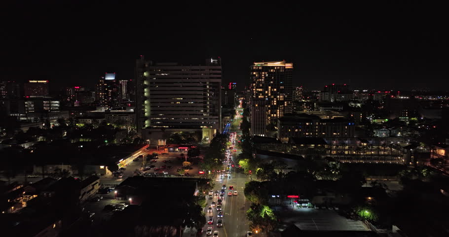 San Jose California Aerial v7 low level drone flyover from horace mann along santa clara street towards downtown capturing illuminated urban cityscape at night - Shot with Mavic 3 Cine - June 2022
