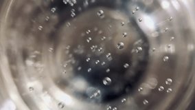 Top view close-up of effervescent bubbles in a champagne glass, a festive concept - Powered by Shutterstock - Get 15% off with code: PIKWIZARD15