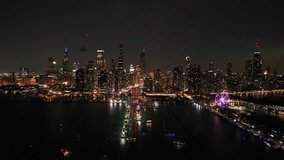 Drone shot of the Chicago skyline, during fourth of July night celebration - Powered by Shutterstock - Get 15% off with code: PIKWIZARD15