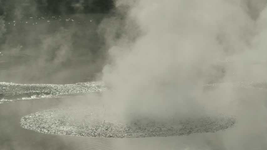 Geological spectacle of geothermal bubbling mud eruption with hot vapor