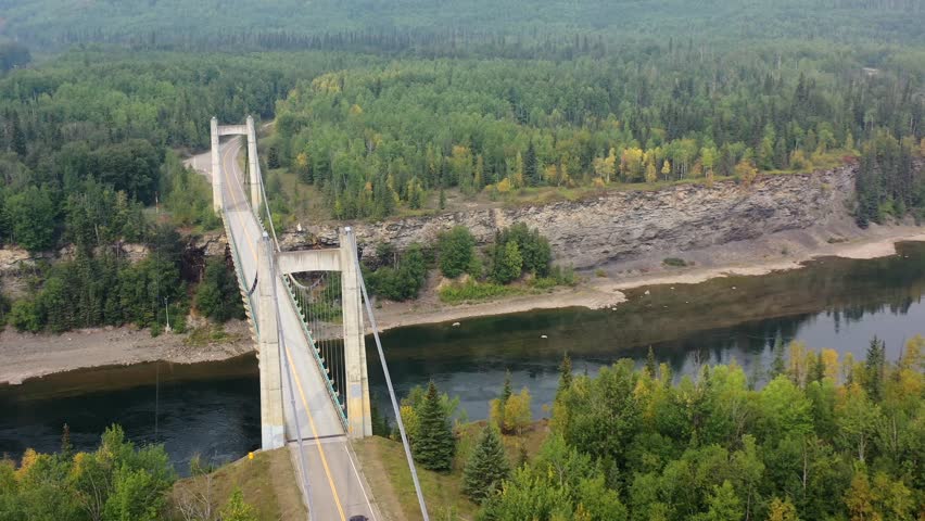 Aerial footage of Peace River suspension bridge in Hudson Hope, BC