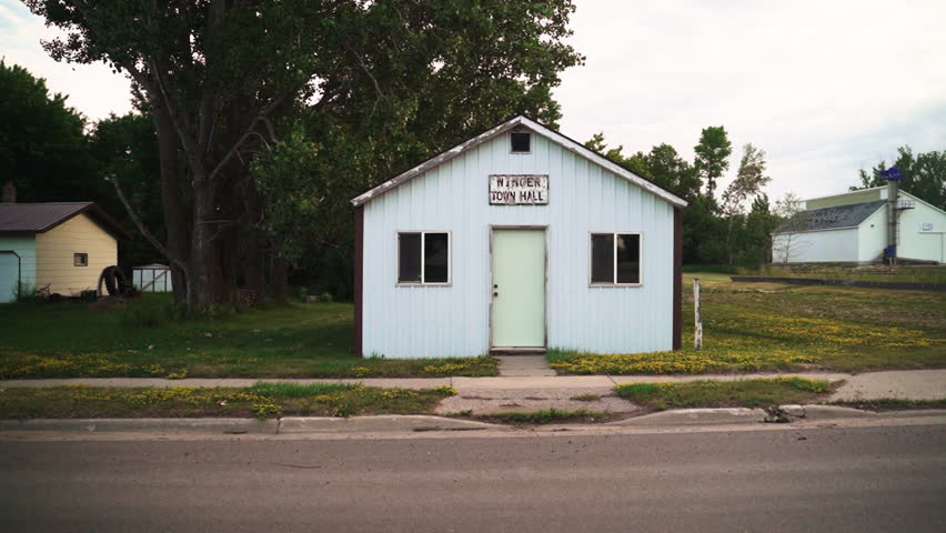 Pan-in Shot of Abandoned Small Town Hall in Rural Suburb