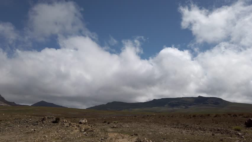 White Cloudscape Over Mountains Of Las Lagunas de Alto Peru Near Cajamarca, Peru. Panning Shot