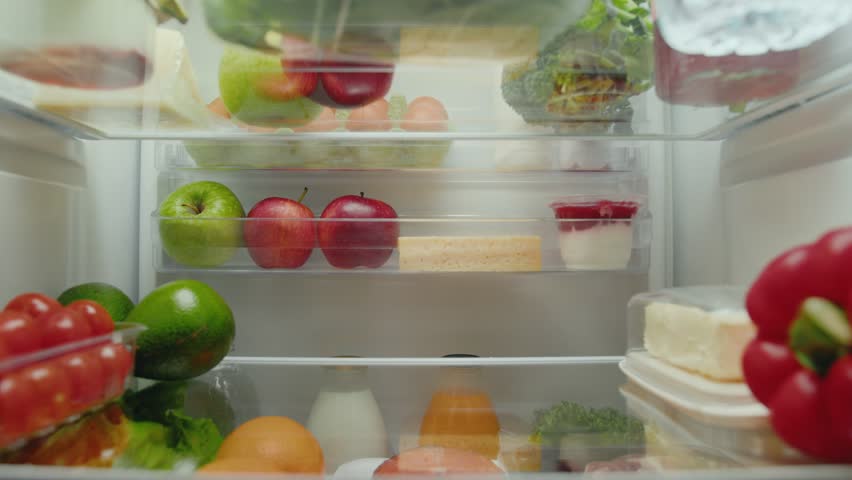 Young Woman Opening Fridge with Fresh Food of Fruits and Vegetables and Taking Glass Bottle to Drink. Kitchen Refrigerator of Healthy Lady Cooking Meal. Freezer Filled of Convenience Purchase to Eat Royalty-Free Stock Footage #1108304901