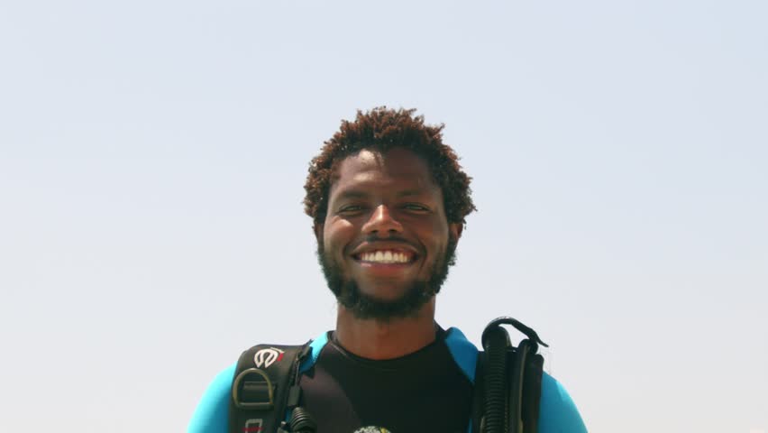 Portrait Of A Happy Volunteer Scuba Diver After A Succesful Dive During Marine Conservation. Close Up