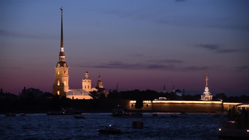 Side view from tour boat of illuminated Russian Orthodox Saints Peter and Paul Cathedral at night in Saint Petersburg, Russia. Religious architecture. Real time handheld video. Water tourism theme. | Shutterstock HD Video #1108307875