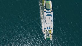 Top down aerial view on passenger and vehicle ferry boat sailing in sea - Powered by Shutterstock - Get 15% off with code: PIKWIZARD15