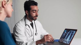 Multi national doctor and patient consulting in consultation room. - Powered by Shutterstock - Get 15% off with code: PIKWIZARD15