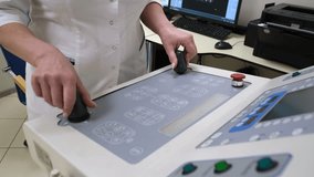 The radiologist controls the device using the control panel. - Powered by Shutterstock - Get 15% off with code: PIKWIZARD15