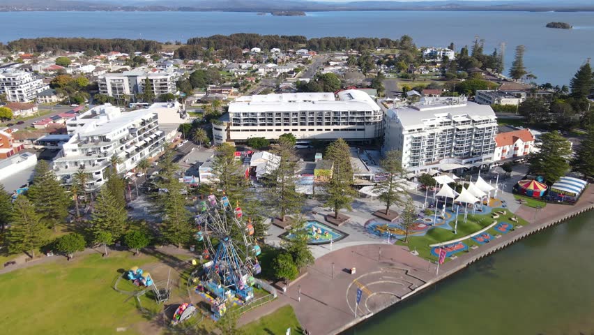 Aerial drone view above The Entrance and Tuggerah Lake on the Brisbane Water of Central Coast, New South Wales, Australia on a sunny morning  Royalty-Free Stock Footage #1108325103