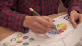 Businessman analyzing a graphic of a stock exchange chart. - Powered by Shutterstock - Get 15% off with code: PIKWIZARD15