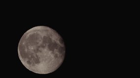 A big full moon behind the tree branches. Big Full Moon Behind Tree Branches Dark Night. Establishing Shot Full Honey Moon Rise Behind Silhouette Branches. Hot air swirls in the moonlight - Powered by Shutterstock - Get 15% off with code: PIKWIZARD15