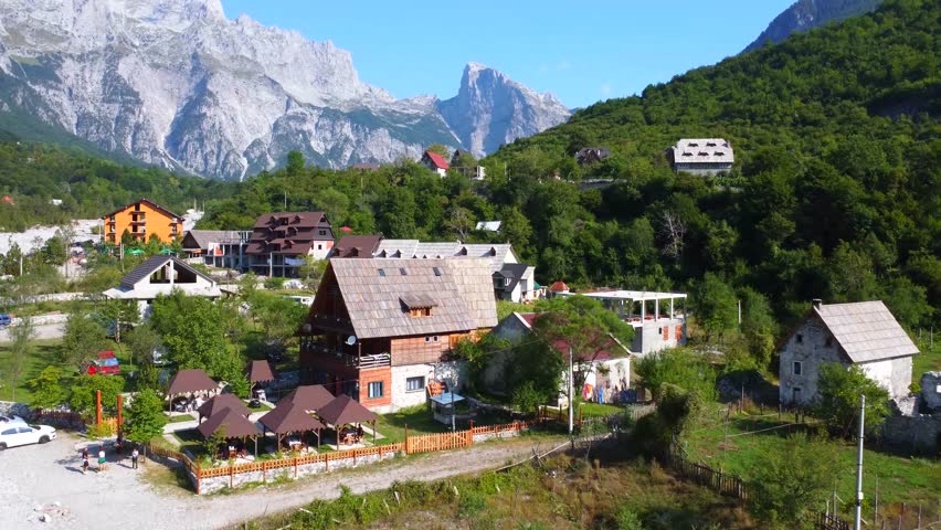 Aerial drone view of the rustic homes in Theth National Park, Albania. Albanian Alps