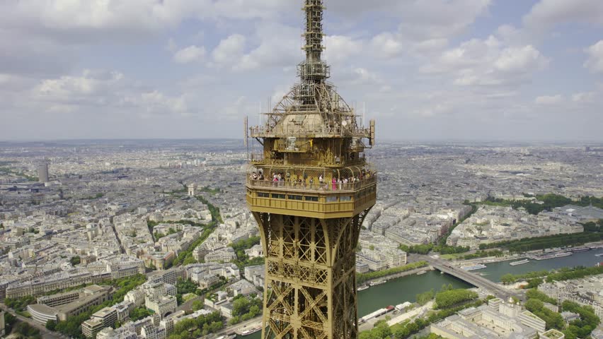 Aerial view of the observation deck at the top of the Eiffel Tower, 276 meters high, in Paris, France. Cinematic 4k. Royalty-Free Stock Footage #1108338467