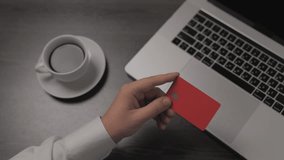 Close-up of male hand typing at laptop, Young man pressed the credit card code to pay online via the computer at the desk in the room, Online purchases of credit cards. Businessman working freelance - Powered by Shutterstock - Get 15% off with code: PIKWIZARD15