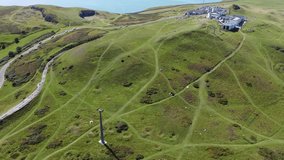 Breathtaking drone clip closing in on the Great Orme cable car and summit station by Llandudno, Wales