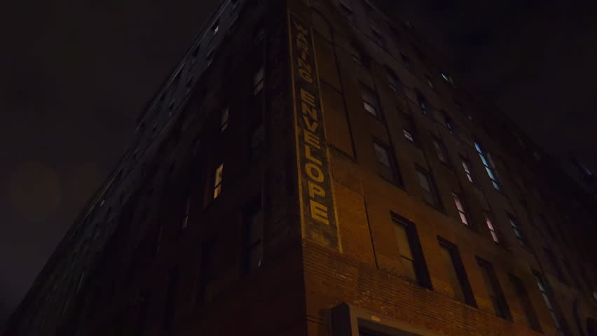 BROOKLYN, NY - 08.11.2023 - A strange and creepy perspective of an old brick apartment building at night in a downtown area. | Shutterstock HD Video #1108343637