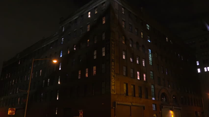 BROOKLYN, NY - 08.11.2023 - A strange and creepy perspective of an old brick apartment building at night in a downtown area. | Shutterstock HD Video #1108343657