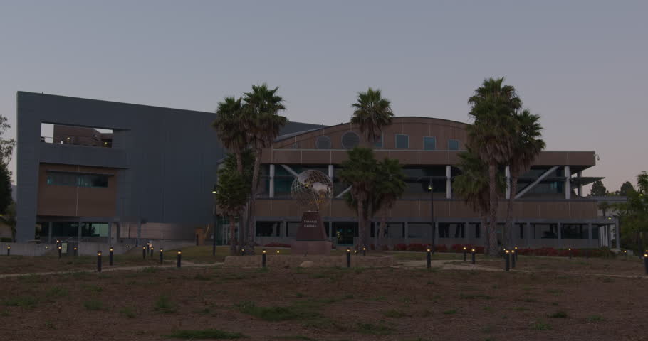 VENTURA, CA - 07.28.2023 - Establishing dusk or night shot of a large corporate headquarters or university campus building with globe statue. | Shutterstock HD Video #1108343865