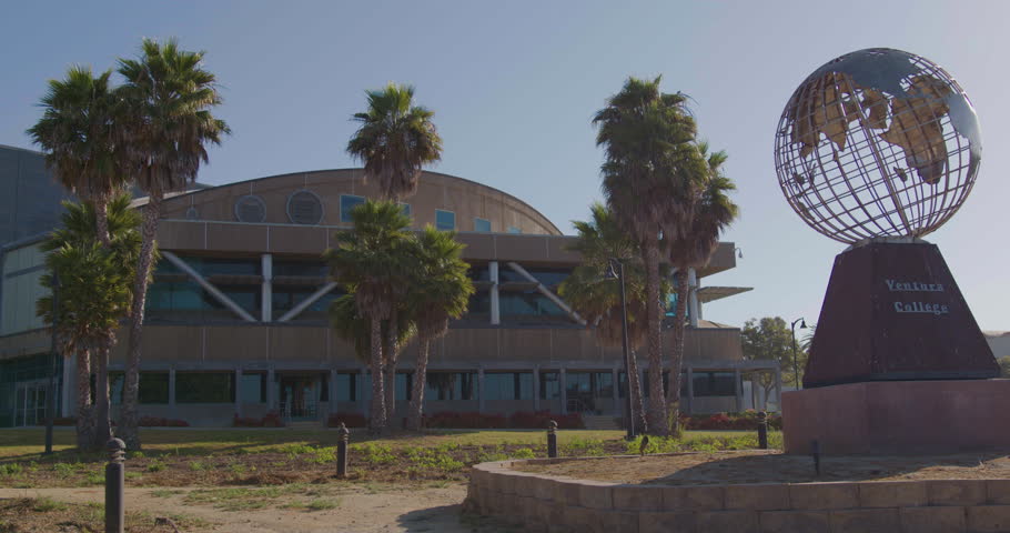 VENTURA, CA - 07.28.2023 - Establishing zoom shot of a large corporate headquarters or university campus administration building with globe statue. | Shutterstock HD Video #1108343875