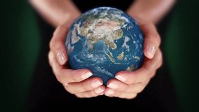 Female Hands Holding 3D Spinning Hyper Realistic Planet Earth. Environmental Conservation, Save the Planet, Ecology, Sustainable Lifestyle. World Earth Day. Loopable from frame 48 to frame 497. - Powered by Shutterstock - Get 15% off with code: PIKWIZARD15