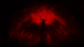 Horned demon stands inside gloom  2D animation. Spooky dark angel. Mysterious light inside murk. Horror fantasy genre. Scary character from nightmares. Creepy video clip. Red and black background.