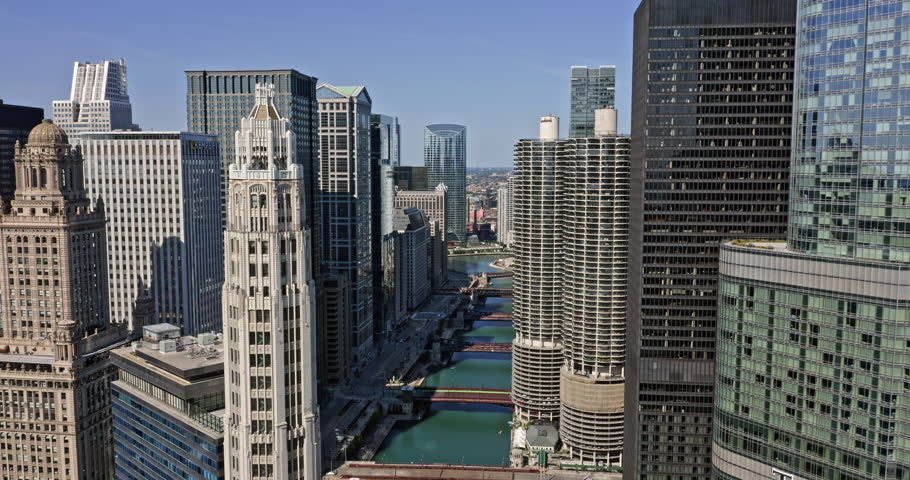 Chicago Illinois Aerial v50 drone flyover capturing ultramodern high rise residential development and office buildings at fulton river district with riverwalk bridges across the waterway - August 2020