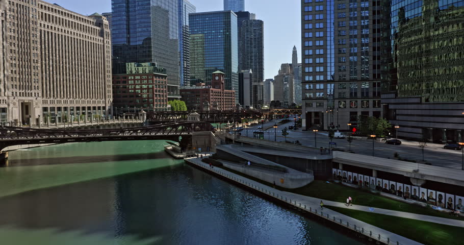 Chicago Illinois Aerial v49 low level flyover bridges and _fly through along the river capturing high rise buildings at riverwalk neighborhood with traffics on wacker drive - August 2020