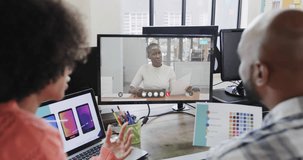 African american business people on video call with african american female colleague on screen. Online connections, business and networking concept.